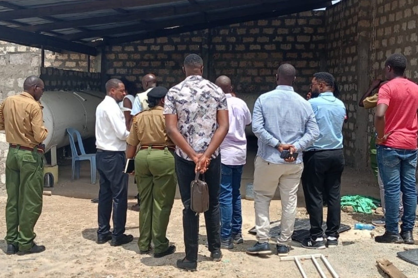 File image of EPRA officials and police officers at an illegal LPG storage facility in Kilifi.
